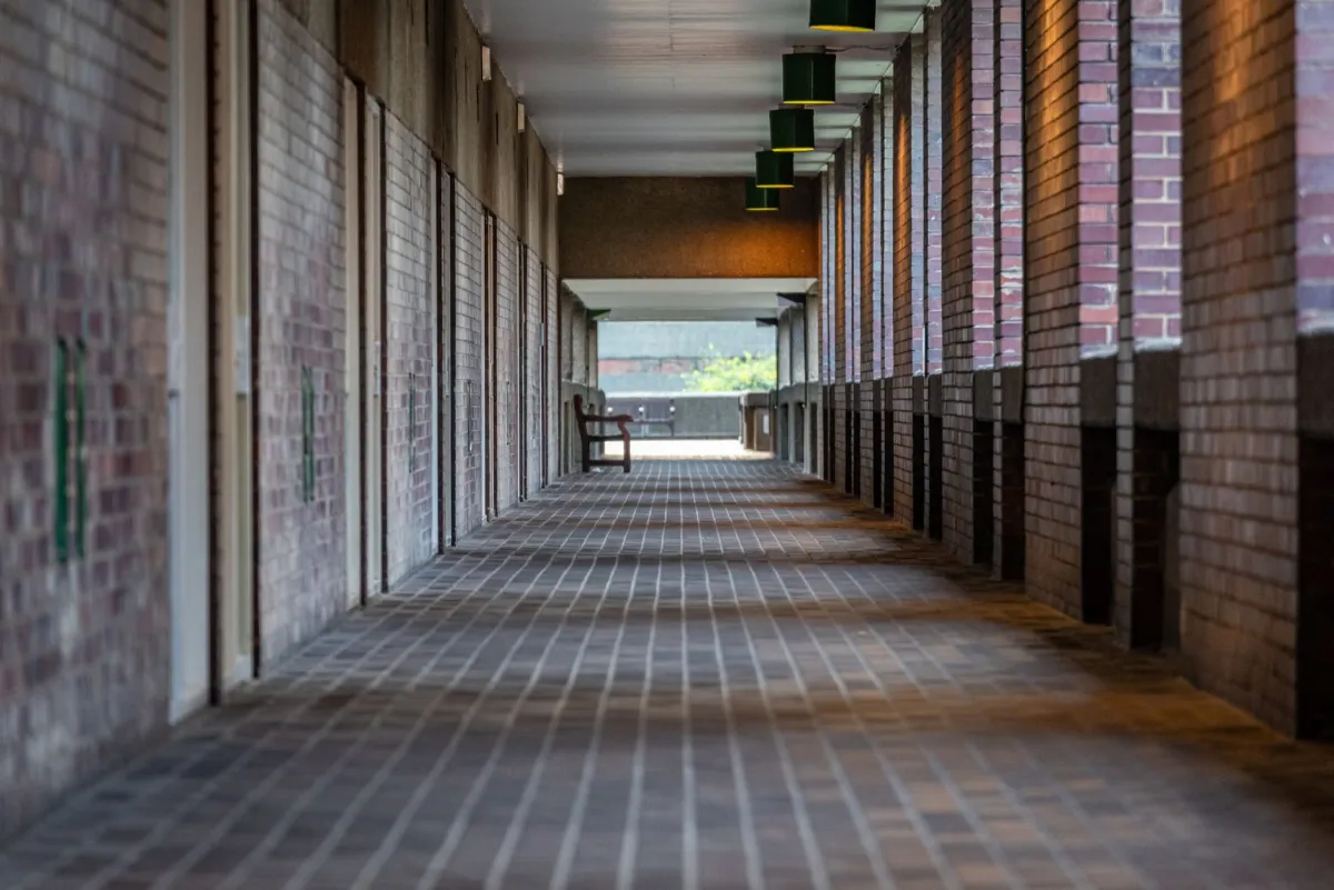 A corridor of server racks representing business cloud infrastructure.