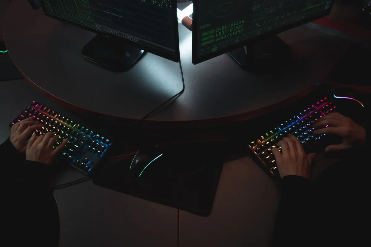 Security analysts monitoring computer systems and reviewing potential threats in an operations centre.